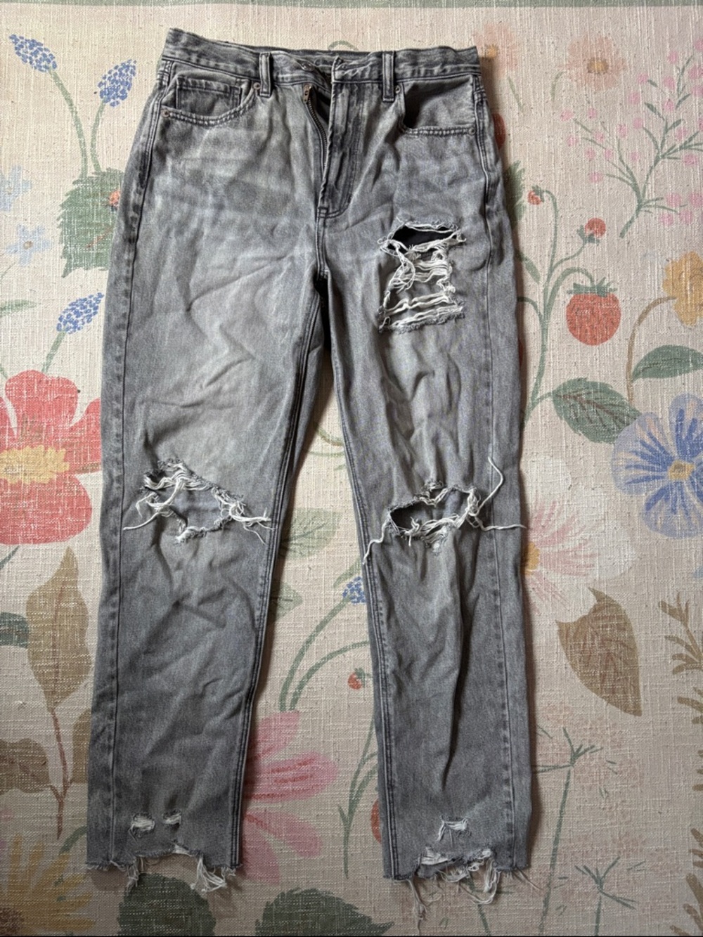 Charcoal gray woman’s ripped jeans